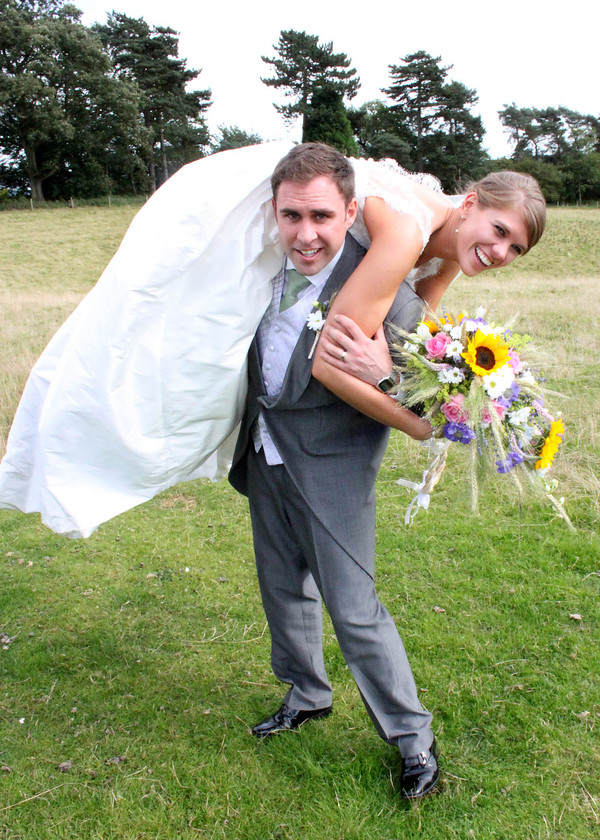 Bride & Groom, fireman s lift! 
 Charlotte Wright Wedding Photography: Brides & Grooms 
 Keywords: Wedding, Photography, Warwickshire